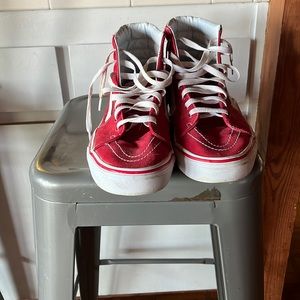 Red old skool high top Vans.